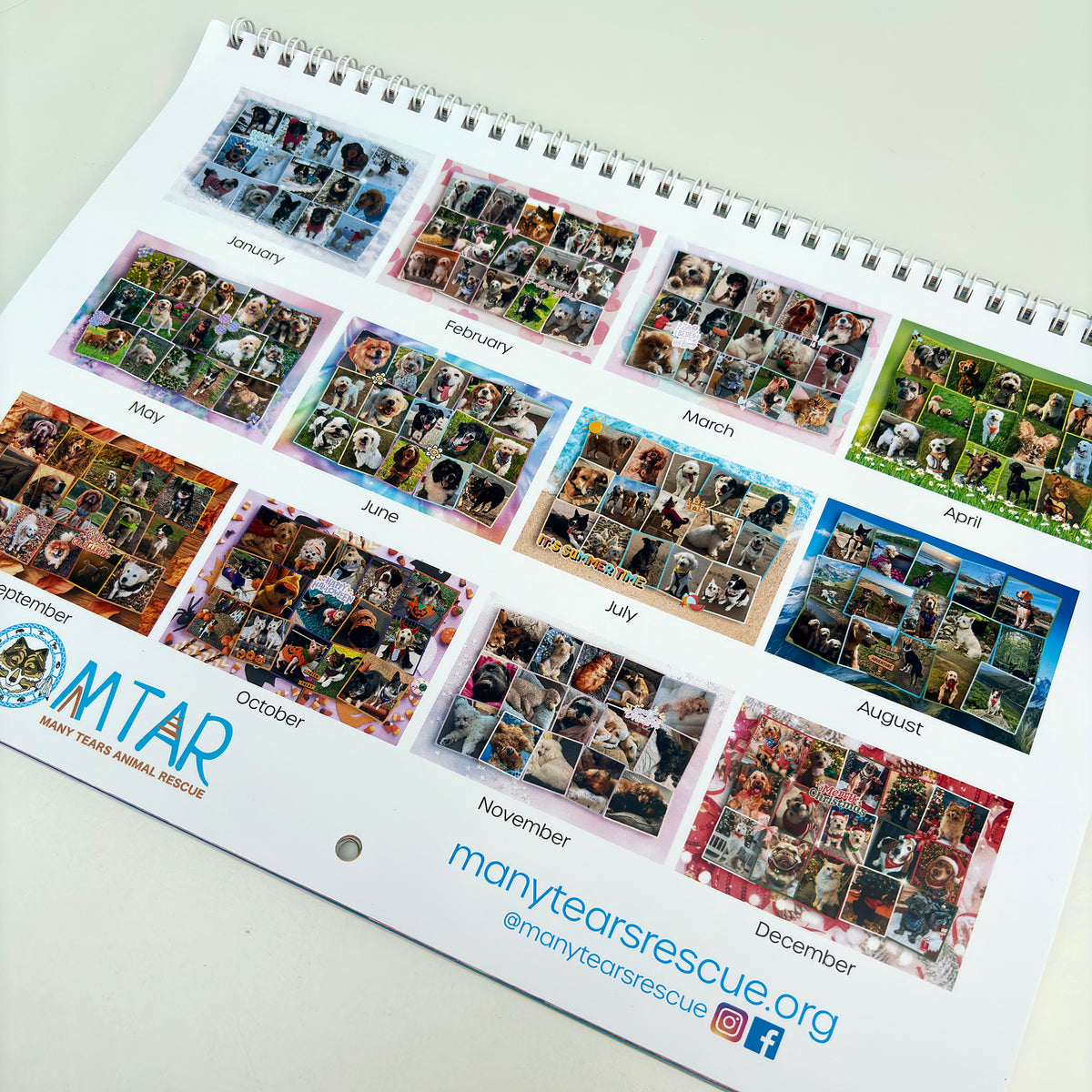 A spiral-bound printed calendar page from Many Tears Animal Rescue, showing monthly photo grids labeled January through December with the Many Tears Rescue branding at the bottom.