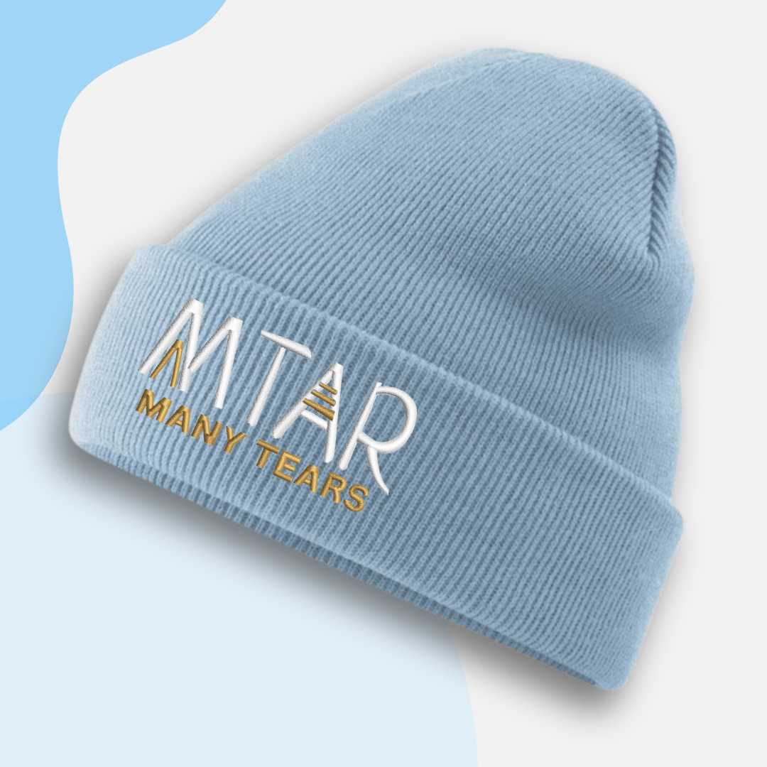 Blue beanie with 'MITAR MANY TEARS' text on a white background